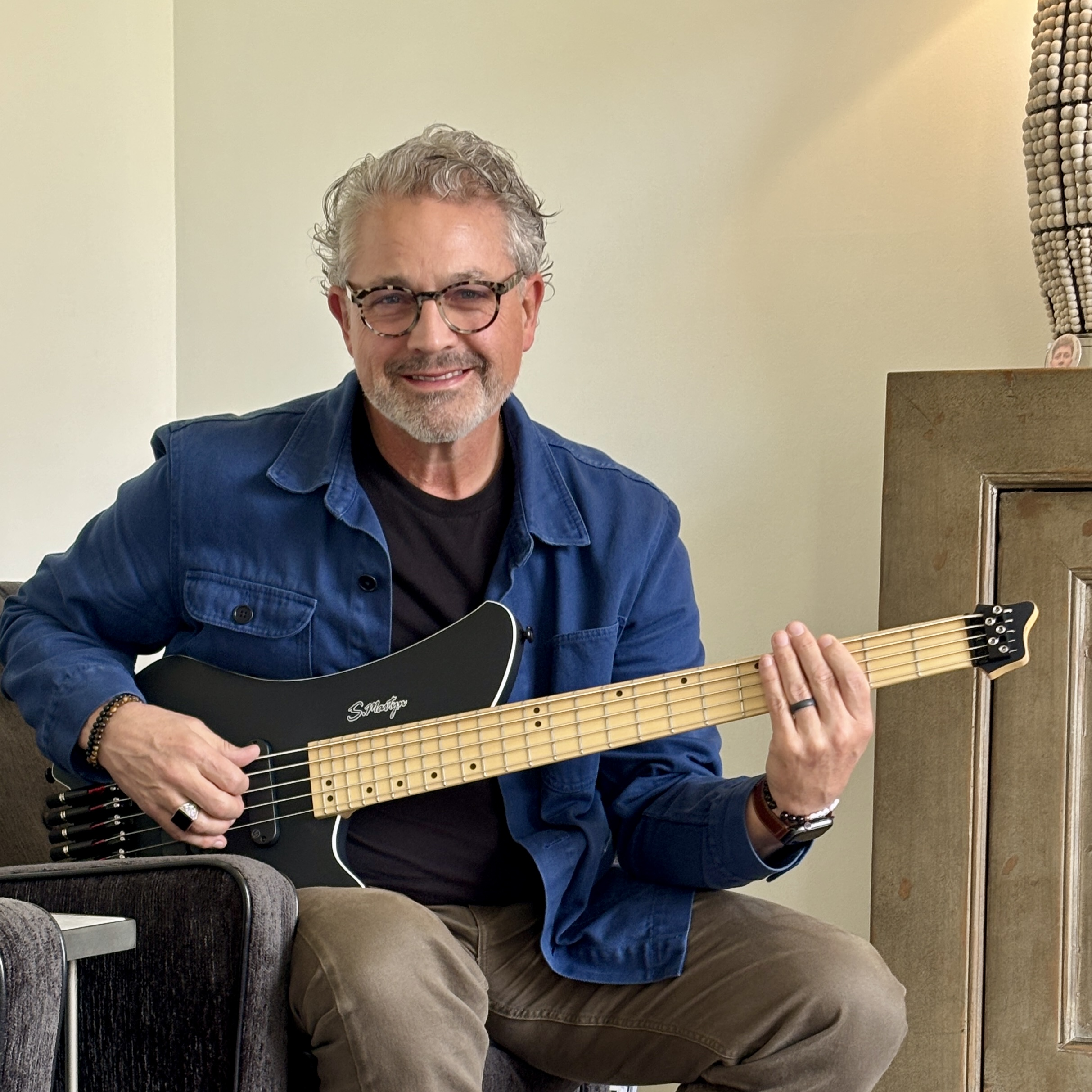 Rick Myers holding his S.Martyn bass